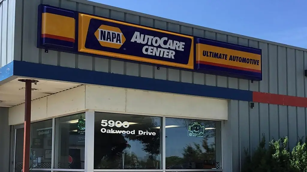 The Ultimate Automotive storefront on Oakwood Drive, the shop sign beside the NAPA AutoCare Center sign